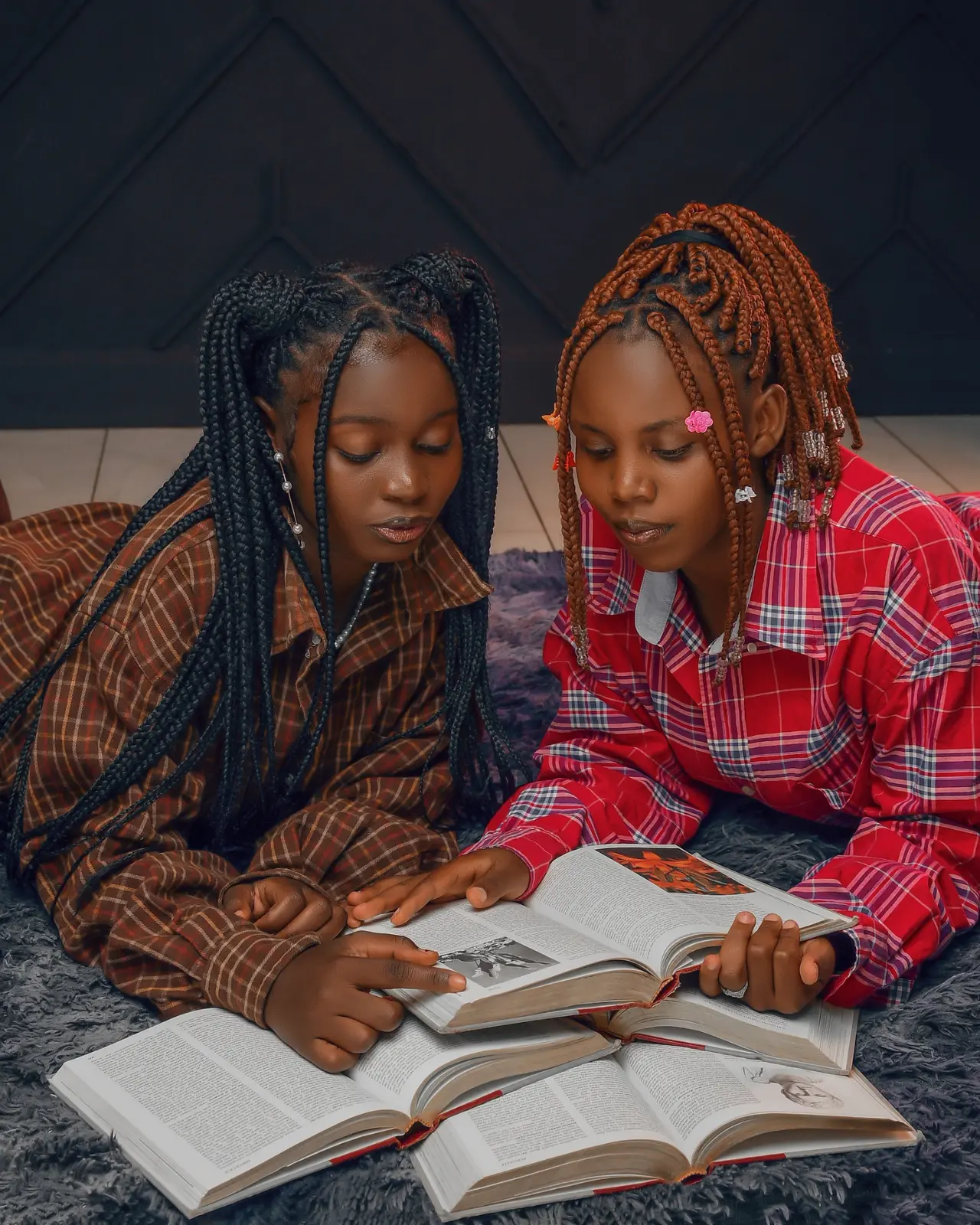 Young readers sharing books